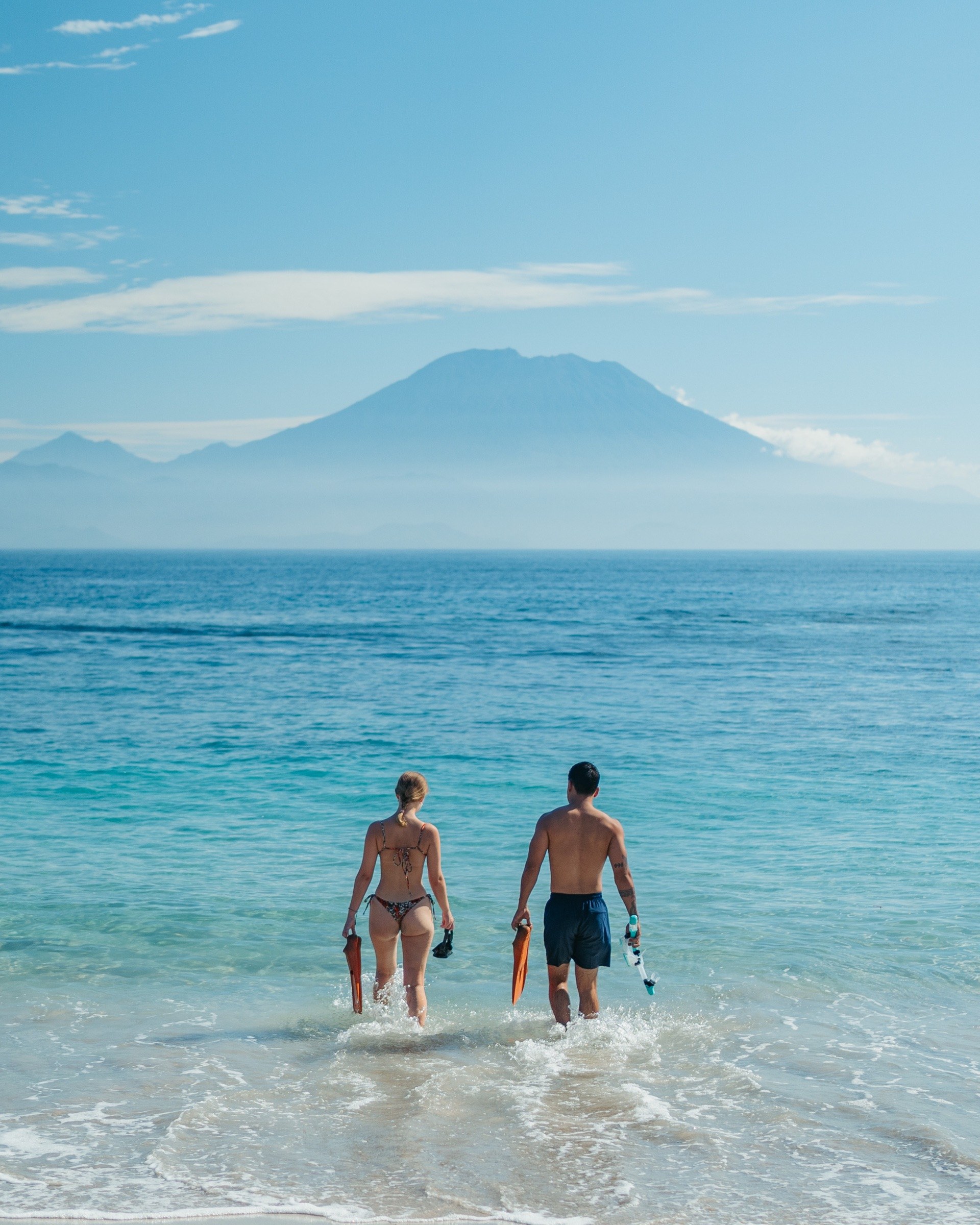 Guests wading out to the ocean at The Sankara Hill Penida